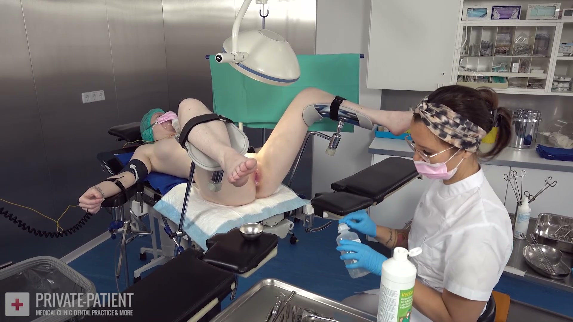 Dr. Eve exploring her lesbian side with a female private patient in the free Year End Treatment 05 lesbian medical femdom video from Amara Fetish Clinic Belgium