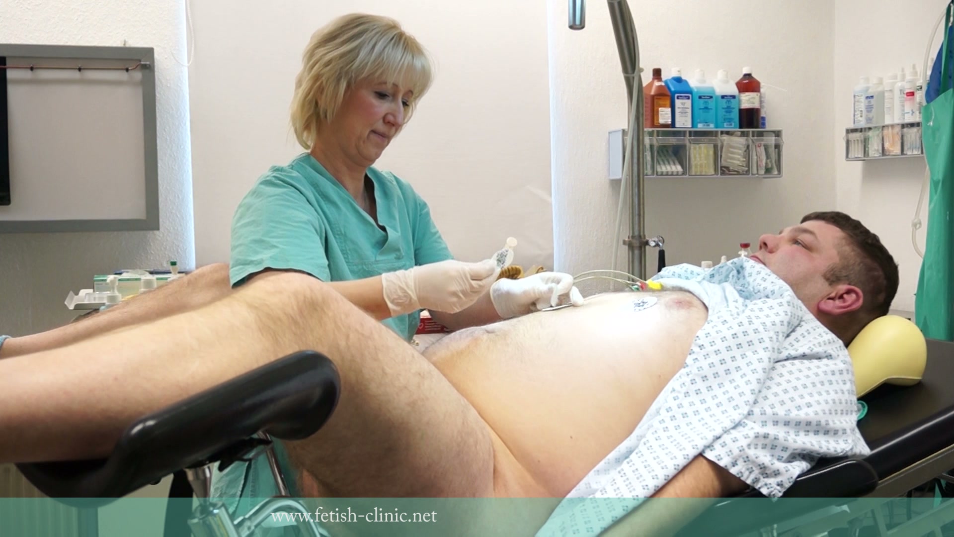 Dr. Annita von Dix milking a patient under genital and cardiovascular control in the free O.R.R. Belgium medical BDSM video from Amara Fetish Clinic Belgium