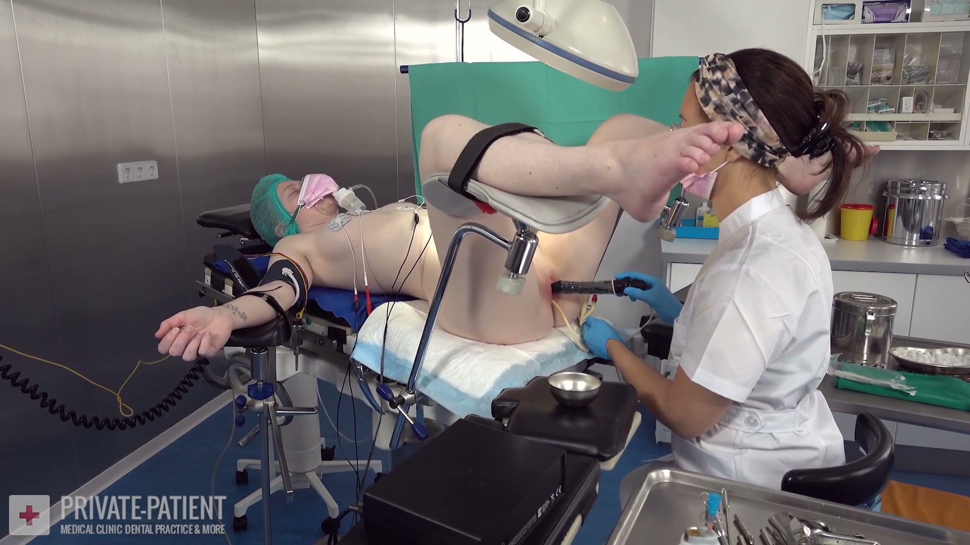 Dr. Eve abusing her nervous young private patient in the free Year End Treatment part seven medical BDSM final video from Amara Fetish Clinic Belgium